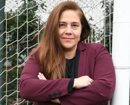 Gülhan Gündüz beside a football goal net