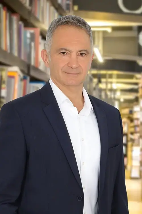 İrfan Yücesoy in a dark suit and white shirt